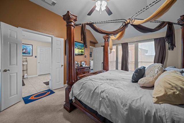 carpeted bedroom featuring vaulted ceiling and visible vents