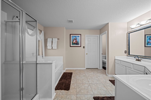 bathroom with a stall shower, a garden tub, vanity, and toilet