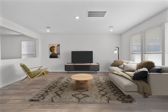 7611 Coral Key Dr, Cypress, TX 77433 - living area featuring visible vents, wood finished floors, and recessed lighting