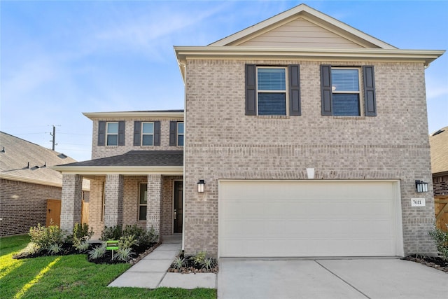 7611 Coral Key Dr, Cypress, TX 77433 - traditional home featuring concrete driveway, brick siding, covered porch, and a garage