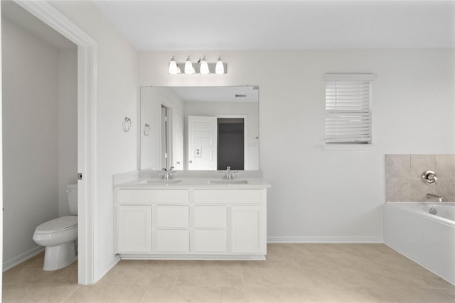 7611 Coral Key Dr, Cypress, TX 77433 - full bath featuring double vanity, a bath, toilet, and a sink