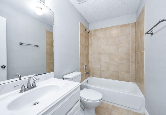 bathroom with toilet, tile patterned floors, a textured ceiling, vanity, and shower / bathing tub combination
