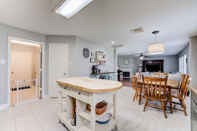 dining area with a ceiling fan, recessed lighting, visible vents, and light tile patterned flooring