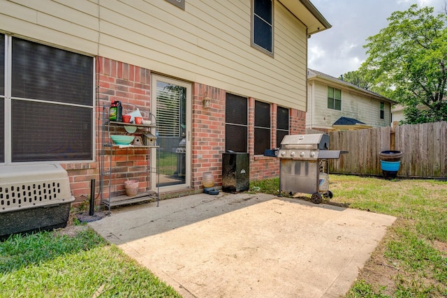 view of patio / terrace with fence and grilling area