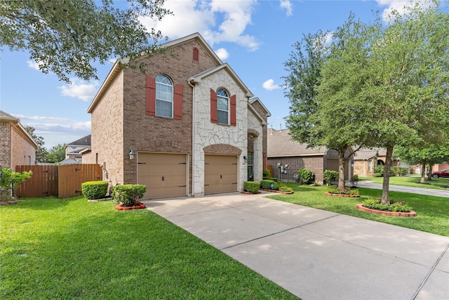 traditional-style home with driveway, brick siding, an attached garage, and a front yard