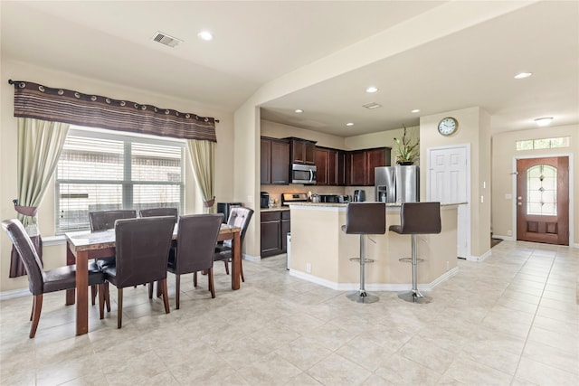 dining area featuring baseboards, plenty of natural light, and recessed lighting