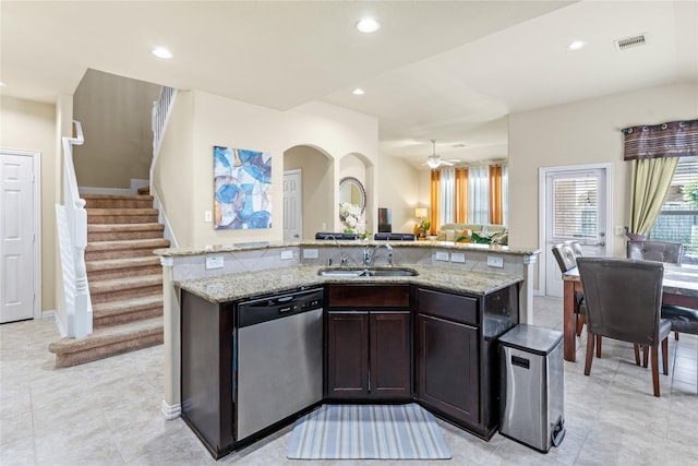 kitchen with a sink, visible vents, recessed lighting, dishwasher, and light stone countertops
