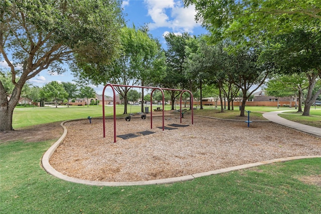 communal playground featuring a yard
