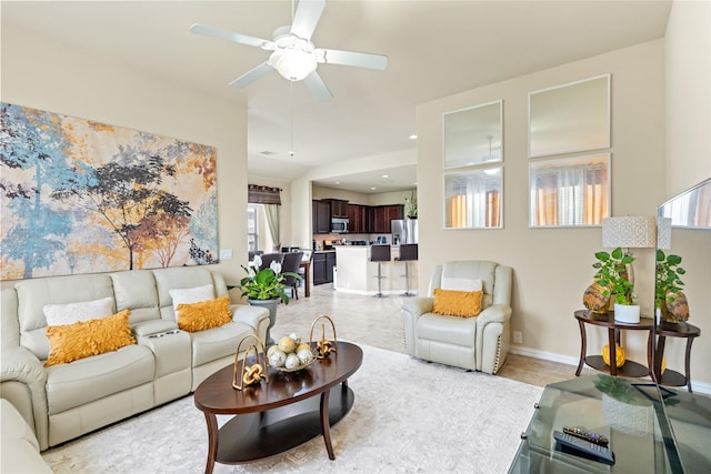 living area with light tile patterned floors, recessed lighting, a healthy amount of sunlight, and ceiling fan