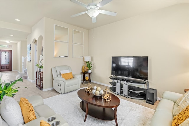 living room featuring tile patterned flooring, baseboards, a ceiling fan, and recessed lighting