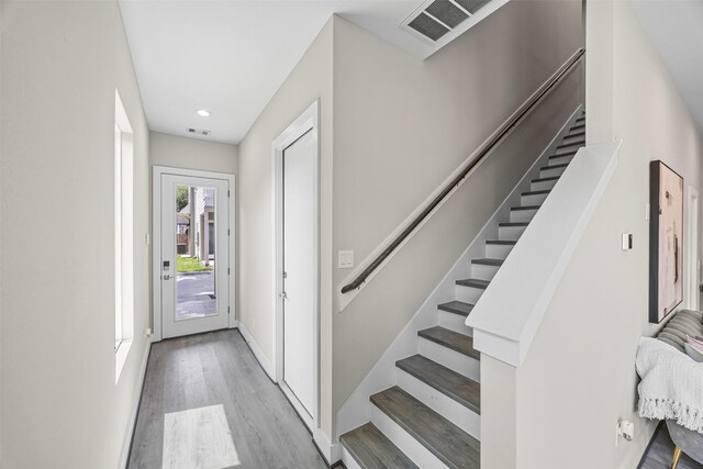 855 Prosper St, Houston, TX 77088 - foyer entrance with light wood-type flooring, visible vents, stairway, and recessed lighting