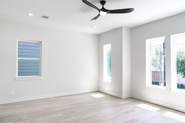 spare room featuring a ceiling fan, light wood-type flooring, baseboards, and recessed lighting