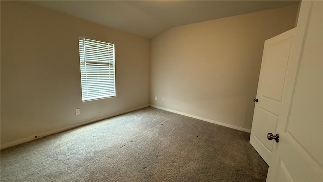 117 Avalon Dr, Huntsville, TX 77320 - empty room featuring carpet, baseboards, and lofted ceiling
