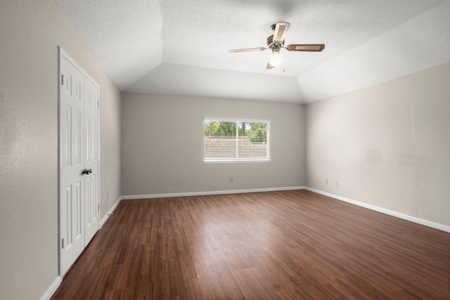 12522 Bent Pine Dr, Cypress, TX 77429 - empty room featuring vaulted ceiling, baseboards, wood finished floors, and a ceiling fan
