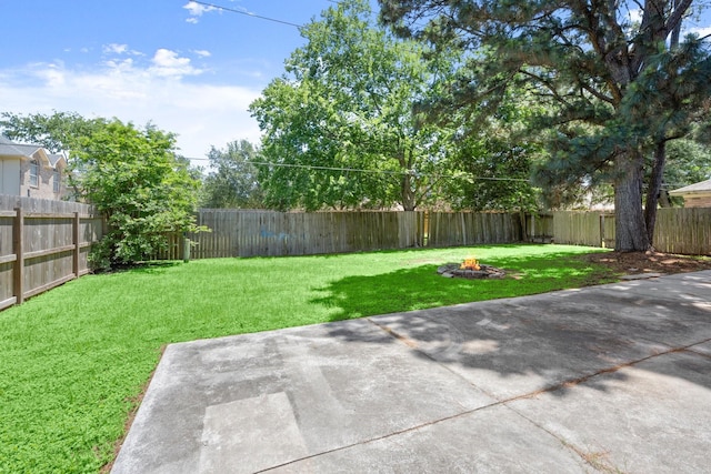 12522 Bent Pine Dr, Cypress, TX 77429 - view of yard with a fire pit, a patio area, and a fenced backyard