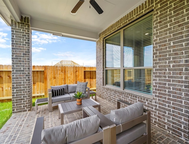 view of patio / terrace featuring a ceiling fan, outdoor lounge area, and fence