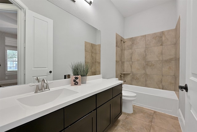bathroom featuring vanity, toilet, tub / shower combination, and tile patterned floors