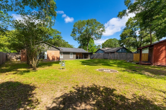 2002 Willowbend St, Conroe, TX 77301 - view of yard with a fire pit