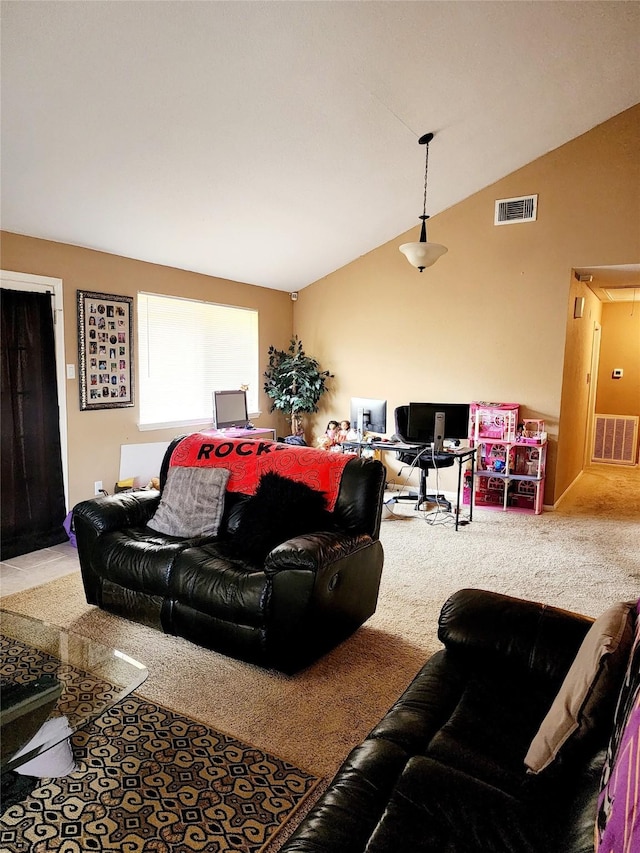 carpeted living room featuring vaulted ceiling, attic access, and visible vents