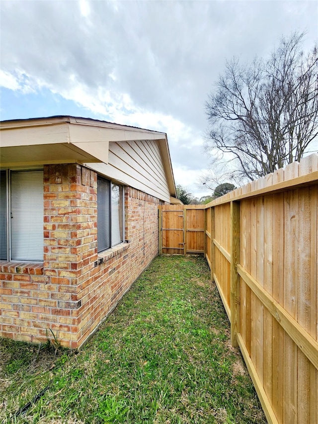view of yard with a fenced backyard