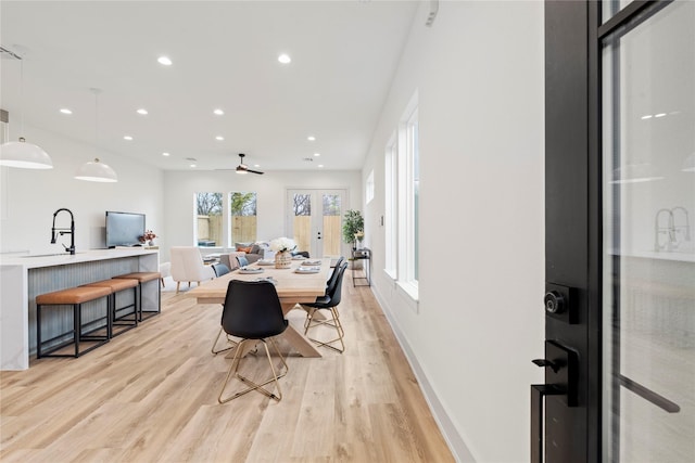 dining area featuring french doors, recessed lighting, a ceiling fan, baseboards, and light wood-style floors