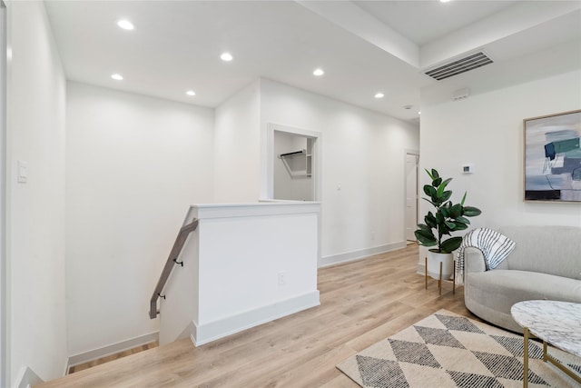 interior space with baseboards, recessed lighting, light wood-style flooring, and visible vents