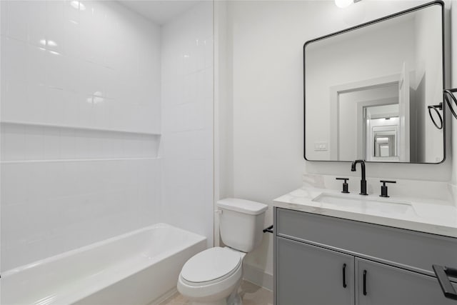 full bathroom featuring toilet, baseboards, vanity, and bathtub / shower combination