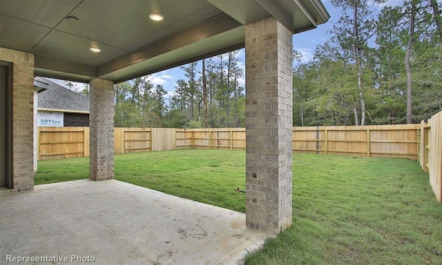view of yard with a fenced backyard and a patio area