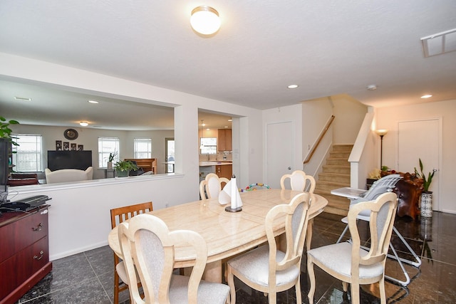 dining room with stairs, visible vents, and recessed lighting