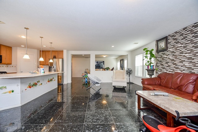 living room featuring recessed lighting, baseboards, and granite finish floor