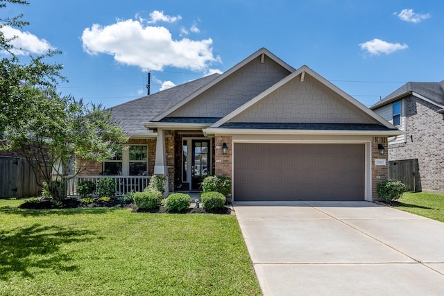 29411 Barker Meadow Ln, Katy, TX 77494 - craftsman house featuring a porch, an attached garage, concrete driveway, brick siding, and roof with shingles