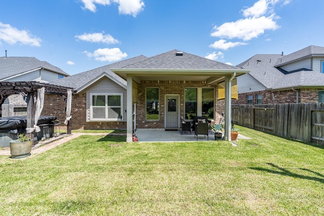 29411 Barker Meadow Ln, Katy, TX 77494 - rear view of house with a pergola, brick siding, a patio area, and roof with shingles
