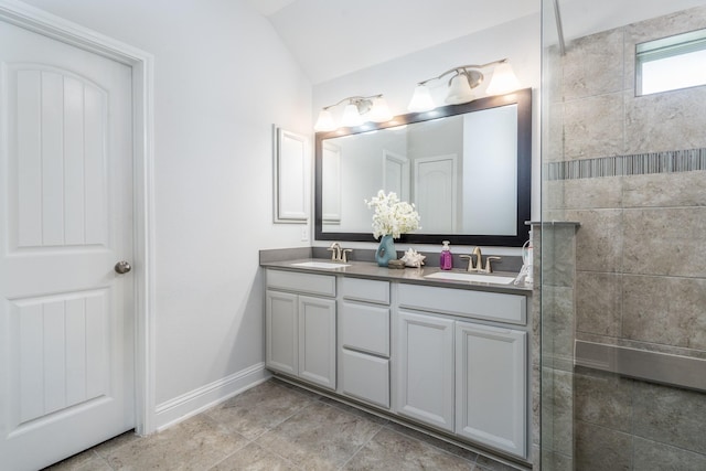 29411 Barker Meadow Ln, Katy, TX 77494 - bathroom with baseboards, double vanity, a walk in shower, and vaulted ceiling