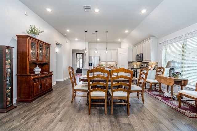 29411 Barker Meadow Ln, Katy, TX 77494 - dining room with dark wood-type flooring, baseboards, recessed lighting, and vaulted ceiling