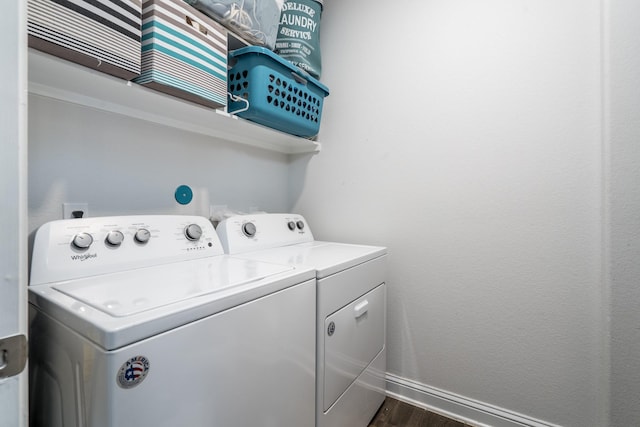 29411 Barker Meadow Ln, Katy, TX 77494 - laundry room with washing machine and clothes dryer, dark wood-type flooring, and baseboards