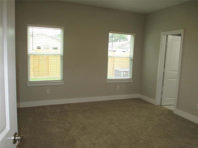 721 E Fayle St, Baytown, TX 77520 - empty room featuring baseboards and carpet floors