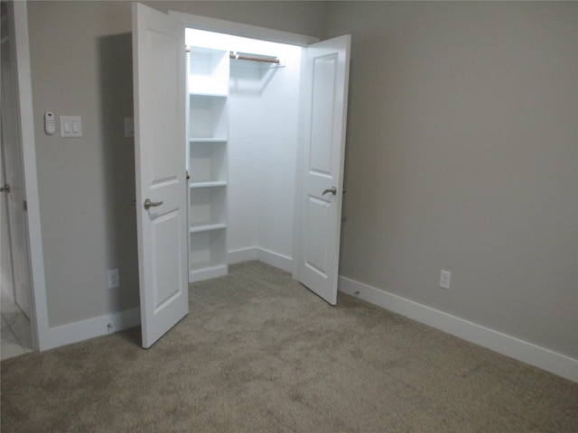 721 E Fayle St, Baytown, TX 77520 - unfurnished bedroom with light carpet and baseboards