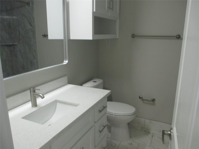 721 E Fayle St, Baytown, TX 77520 - bathroom with toilet, marble finish floor, baseboards, and vanity