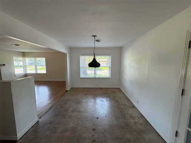 2218 Stonecrest, Houston, TX 77018 - unfurnished dining area with baseboards
