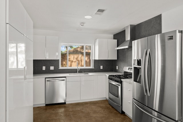 2218 Stonecrest, Houston, TX 77018 - kitchen with appliances with stainless steel finishes, wall chimney range hood, a sink, concrete floors, and modern cabinets