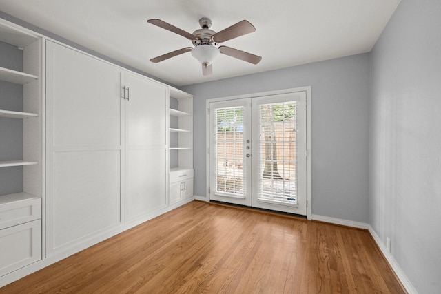 2218 Stonecrest, Houston, TX 77018 - empty room featuring french doors, light wood-style flooring, ceiling fan, and baseboards