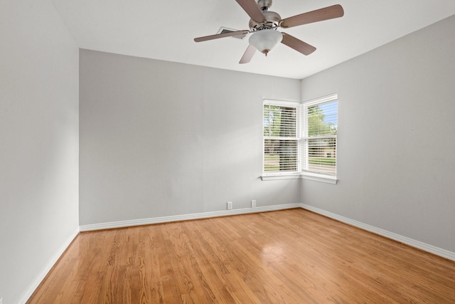 2218 Stonecrest, Houston, TX 77018 - empty room with light wood finished floors, baseboards, and a ceiling fan