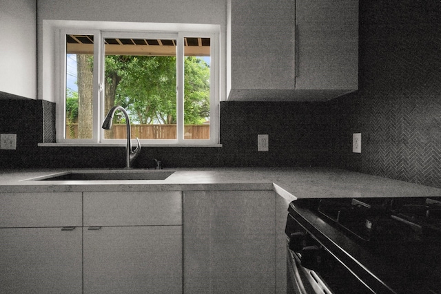 2218 Stonecrest, Houston, TX 77018 - kitchen featuring stainless steel range, a sink, plenty of natural light, and decorative backsplash