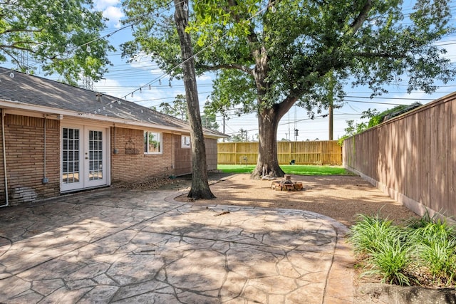 2218 Stonecrest, Houston, TX 77018 - fenced backyard with french doors and a patio area
