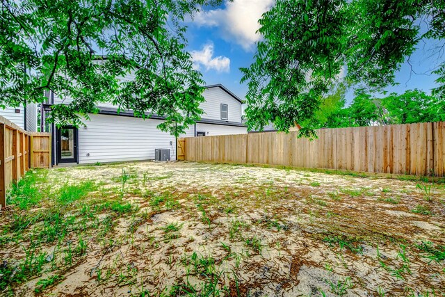fenced backyard with central AC unit