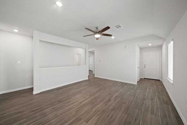 unfurnished living room with ceiling fan, baseboards, visible vents, and dark wood finished floors