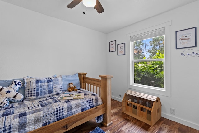 452 N Ghost Branch Rd, Trinity, TX 75862 - bedroom with baseboards, a ceiling fan, and wood finished floors