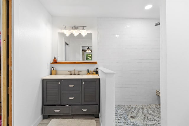 452 N Ghost Branch Rd, Trinity, TX 75862 - full bath featuring vanity, baseboards, tiled shower, and recessed lighting