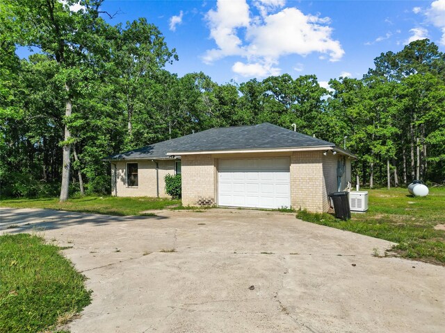 452 N Ghost Branch Rd, Trinity, TX 75862 - exterior space featuring concrete driveway, a shingled roof, and brick siding