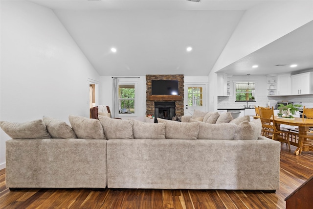 452 N Ghost Branch Rd, Trinity, TX 75862 - living area featuring recessed lighting, a stone fireplace, high vaulted ceiling, and dark wood-style flooring